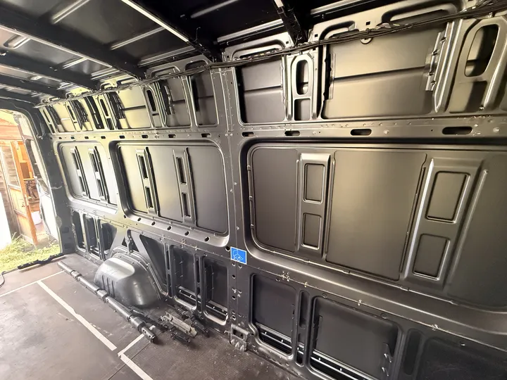 One wall down to the ribs, rails and brackets on the floor.