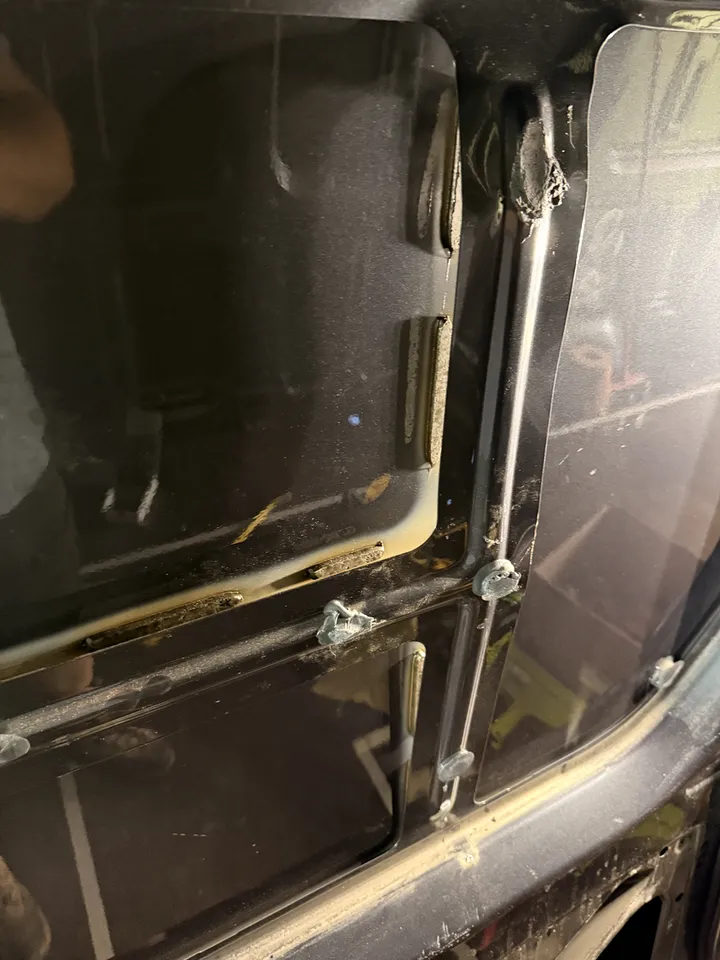 Door structure with the sealant still stuck to it, where the panel was glued on.
