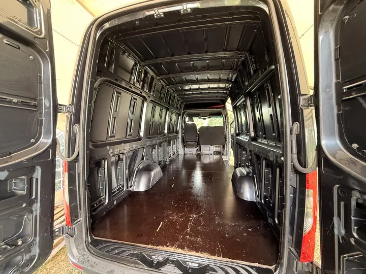 Clean and empty, seen from the rear doors. This is the surface the cork gets sprayed onto.