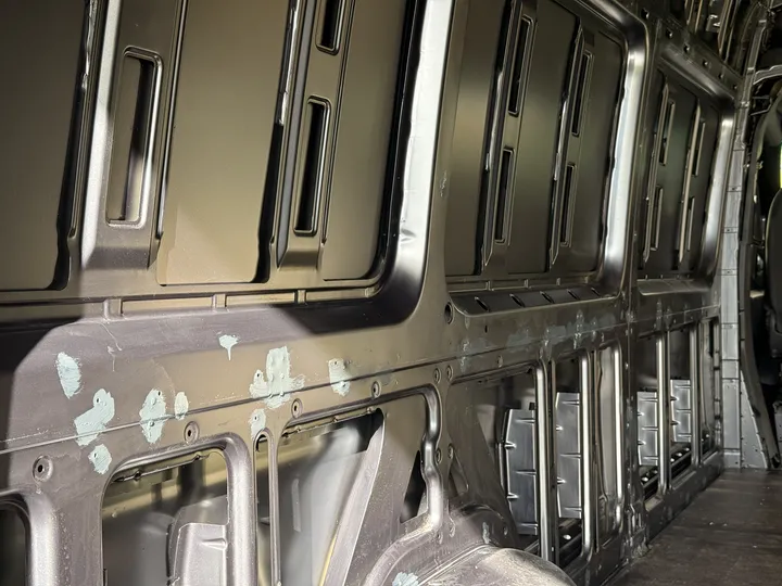 Rust protection on the scratches. Nowhere near the factory colour, and it does not need to be.