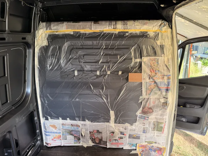 The front closed off with plastic sheet and newspaper. The cab does not get cork.